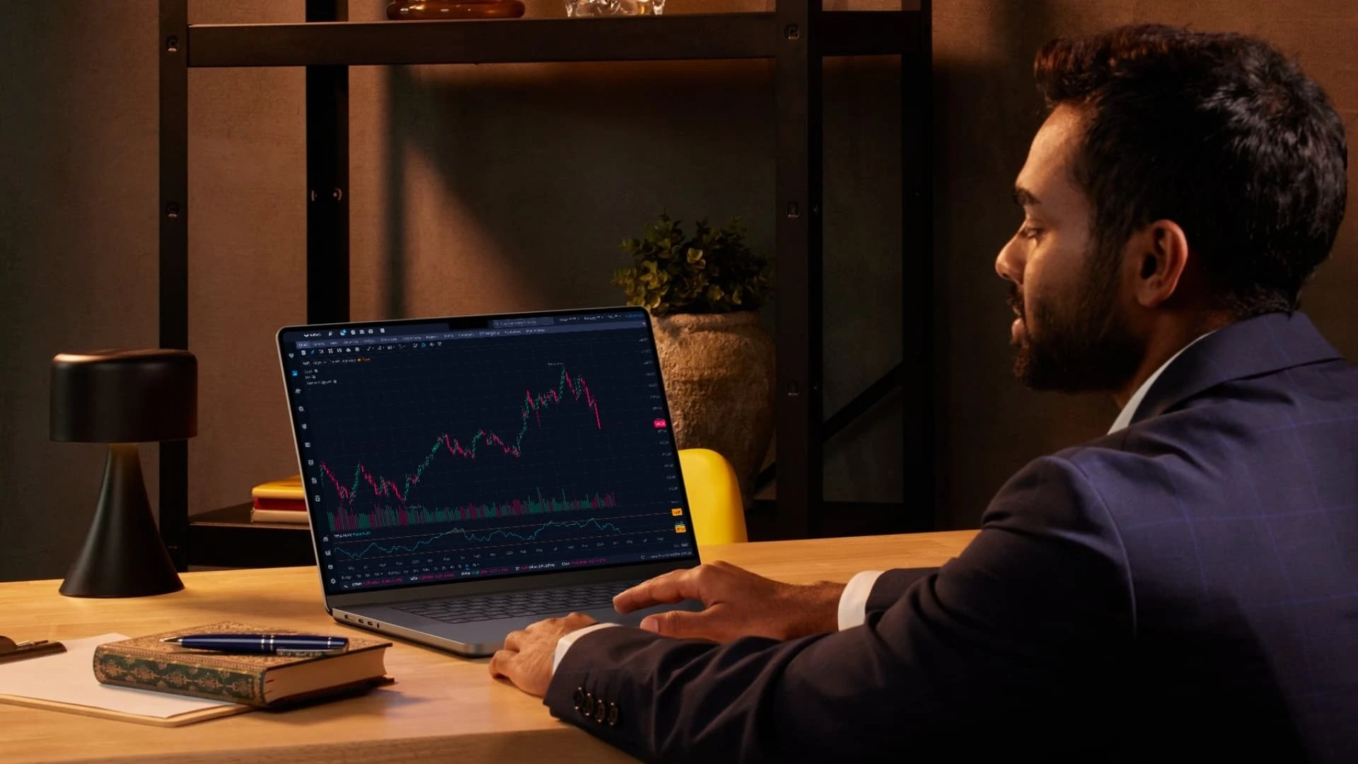 An image of a person looking at a stock chart of aapl in their office.